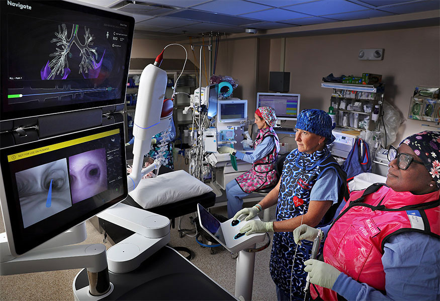 Lab technicians performing a procedure to look at the inside of a patient's heart valves.