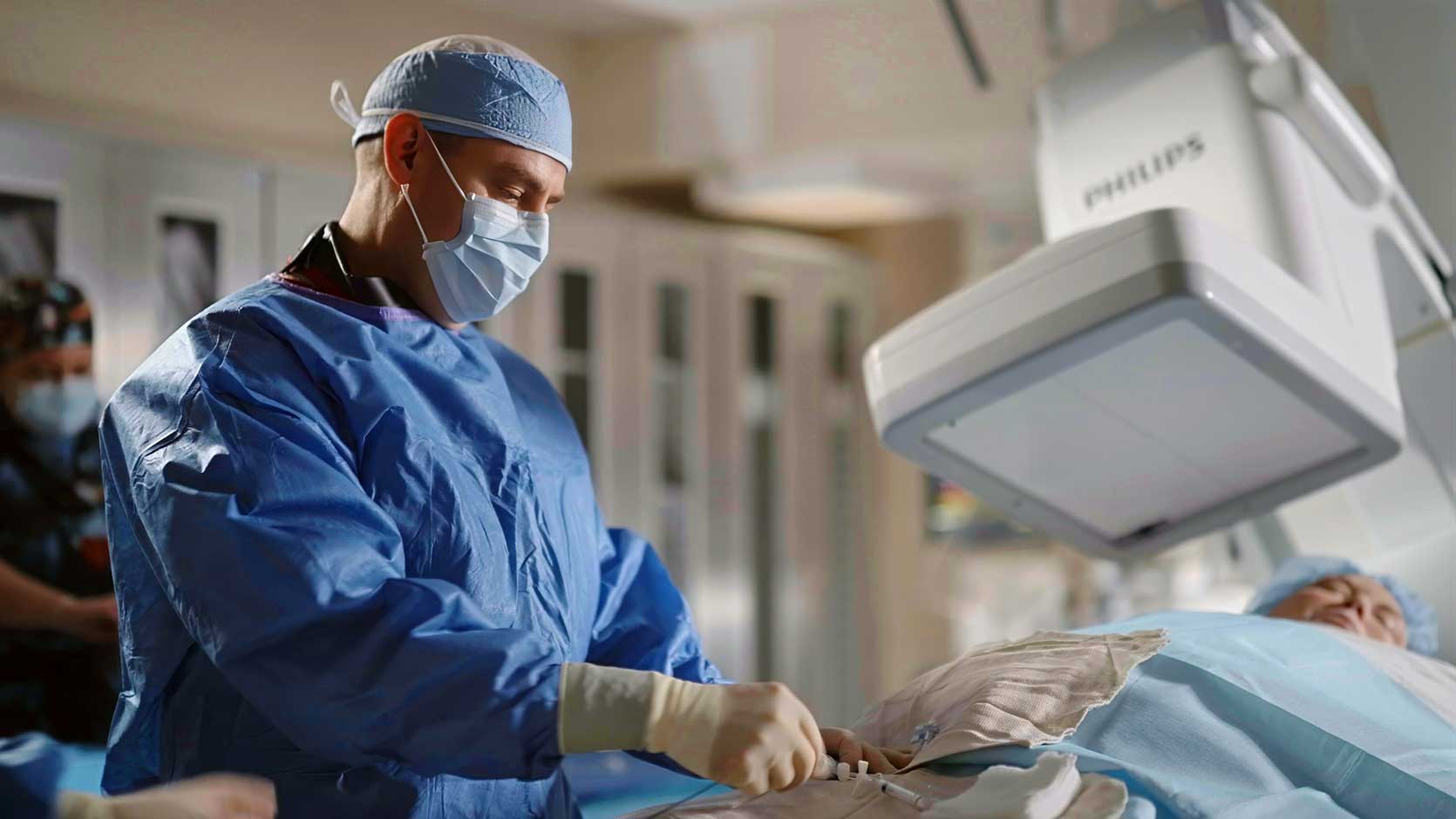 A surgeon performing heart surgery on a patient.